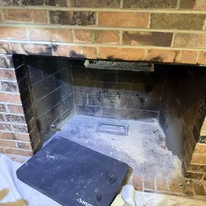 Existing brick masonry firebox in a Hawthorn Woods home before the STUV 6 wood-burning insert installation