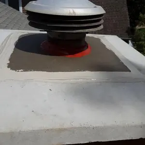 New concrete chimney crown with overhang and sloped surface around the flue