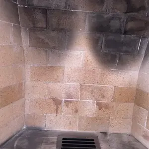 Interior view above a masonry firebox showing the smoke-chamber area documented during the chimney inspection