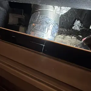 Metal vent connection behind the STUV 6 insert inside the existing masonry firebox
