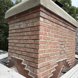 Restored brick chimney masonry prepared for waterproofing in Tower Lakes, IL