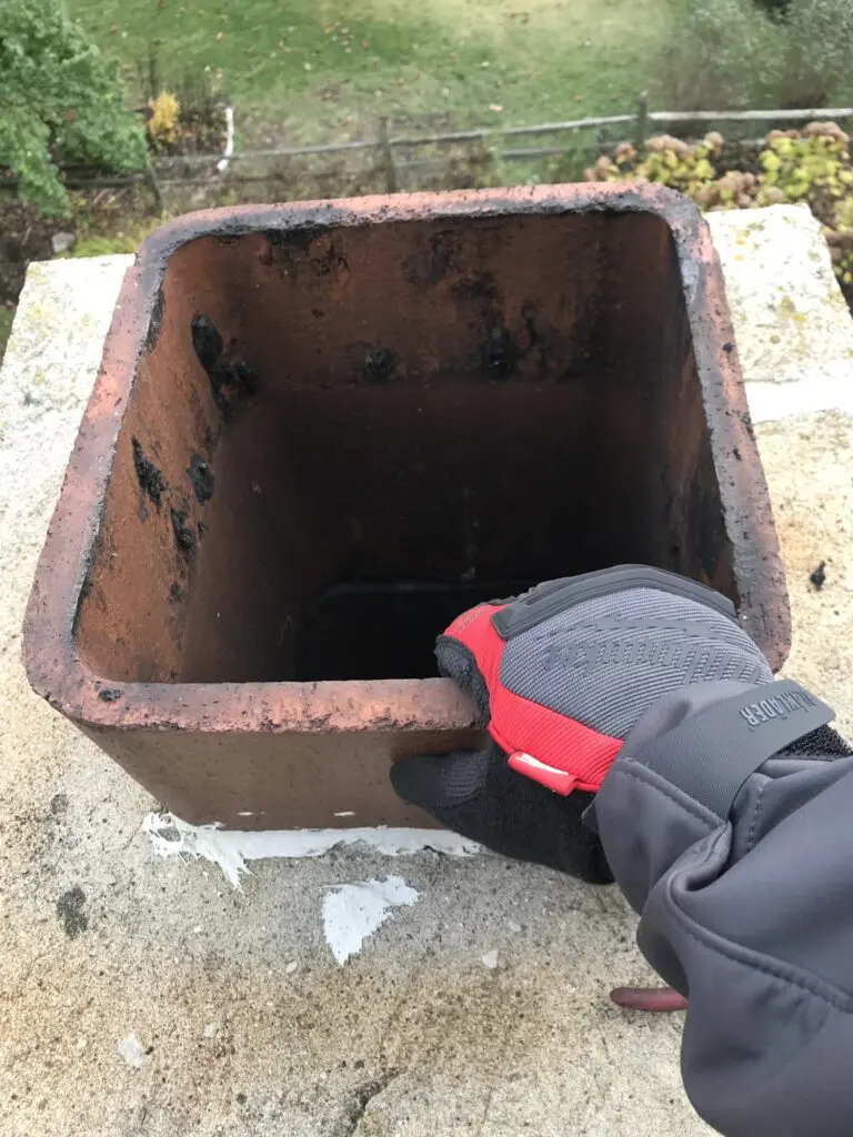 Chimney Monkey technician checking a flue during a chimney inspection on Chicago's North Shore