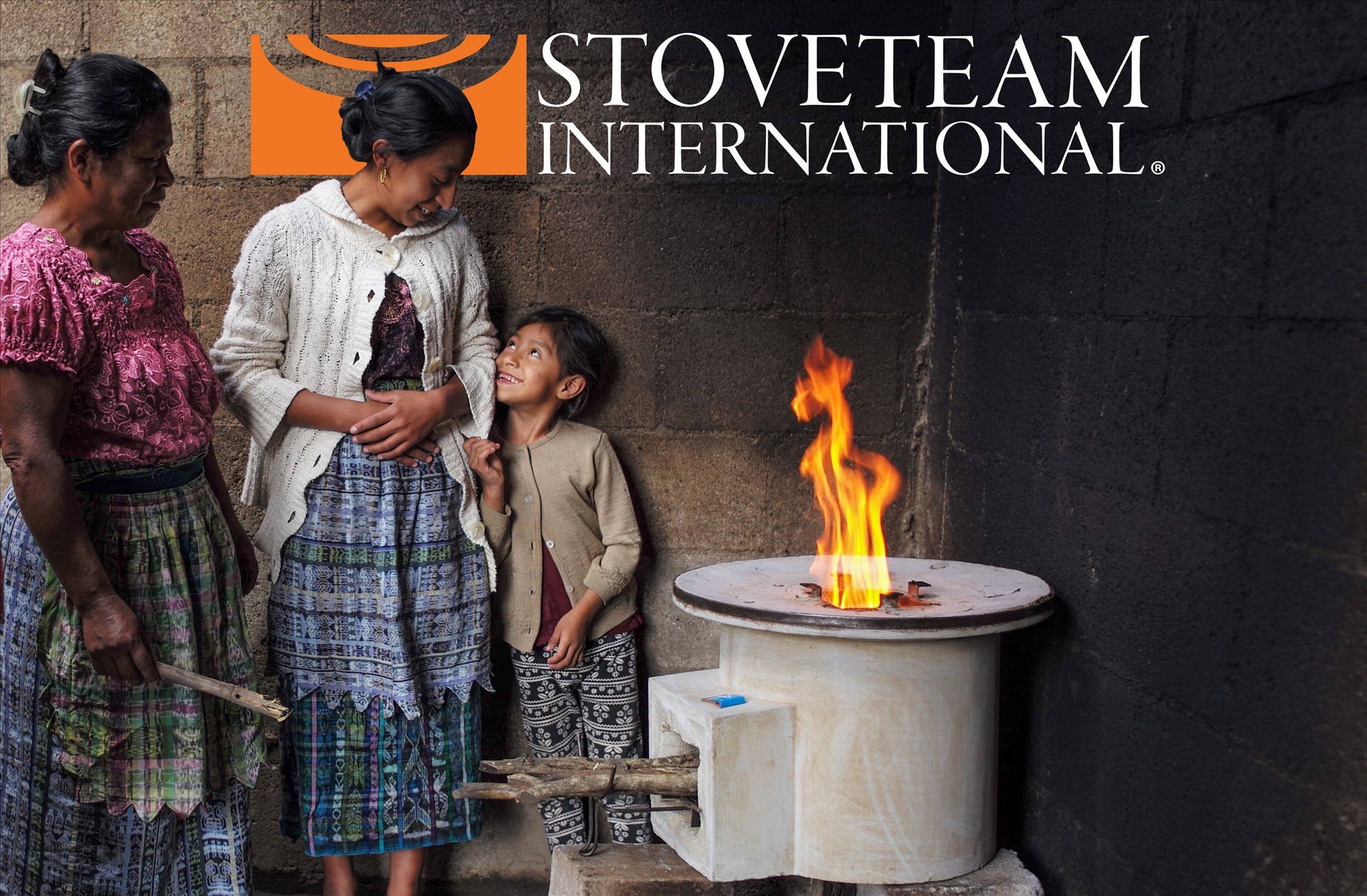 StoveTeam International family with a clean cookstove in Central America